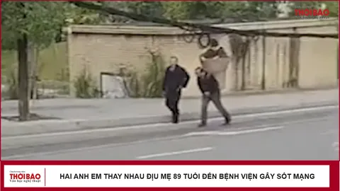 Hai anh em thay nhau địu mẹ 89 tuổi đến bệnh viện gây sốt mạng